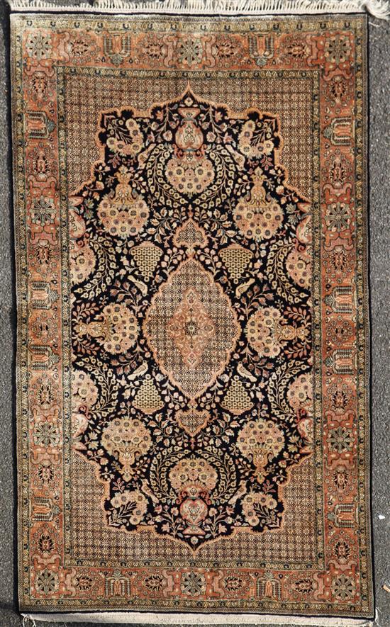 A Persian part silk Qum rug, 7ft by 4ft 6in.